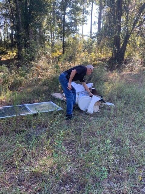 Officer picking up litter